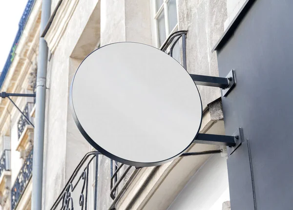 Circular store brand sign board mockup. Empty rounded shop frontage in street