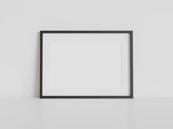 内部モックアップの白い床にもたれて黒の長方形のフレーム 壁に額装された画像のテンプレート3Dレンダリング — ストック写真