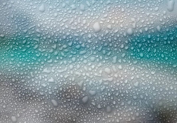 Blue droplets water background. Rain wallpaper with liquid drop