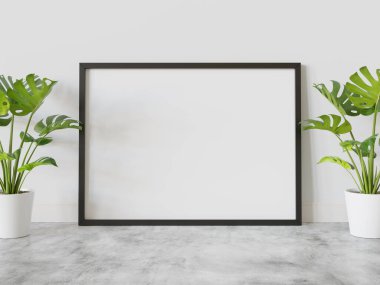 Siyah çerçeve, bitkilerin maketi ile iç kısımda yere dayanıyor. 3 boyutlu bir resimde çerçevelenmiş bir resmin şablonu