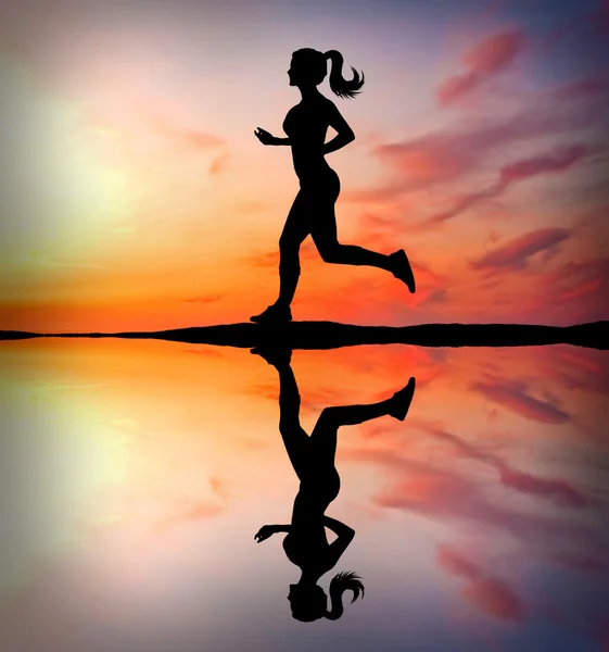 Running girl at sunset silhouette Stock Image
