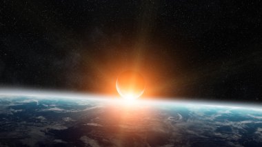 Uzayda Dünya gezegeni üzerinde gündoğumu