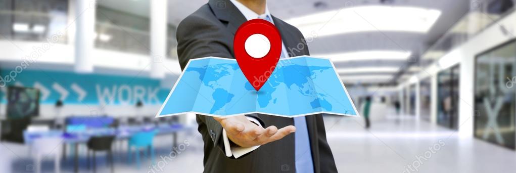 Businessman holding digital map in his hands
