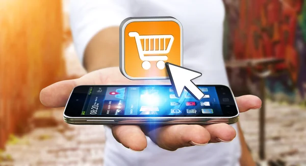 Young man shopping with his mobile phone — Stock Photo, Image