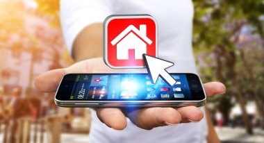 Bir daire kiralamak için modern cep telefonu kullanarak iş adamı