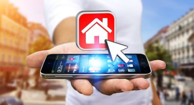 Bir daire kiralamak için modern cep telefonu kullanarak iş adamı