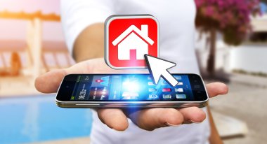 Bir daire kiralamak için modern cep telefonu kullanarak iş adamı