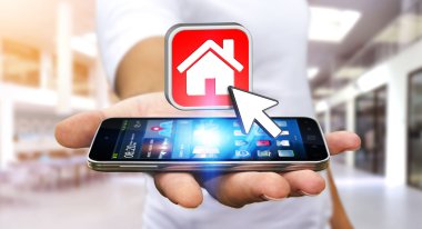 Bir daire kiralamak için modern cep telefonu kullanarak iş adamı