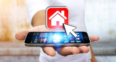 Bir daire kiralamak için modern cep telefonu kullanarak iş adamı