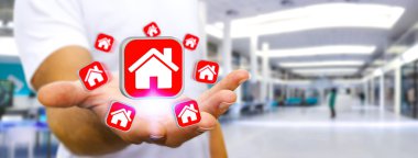 Bir daire kiralamak için modern cep telefonu kullanarak iş adamı
