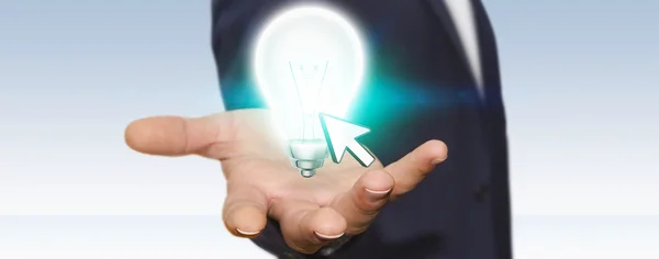 Businessman holding lightbulb — Stock Photo, Image