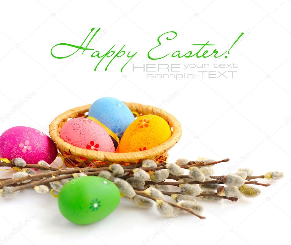 Colorful easter eggs and branches of willow on white background