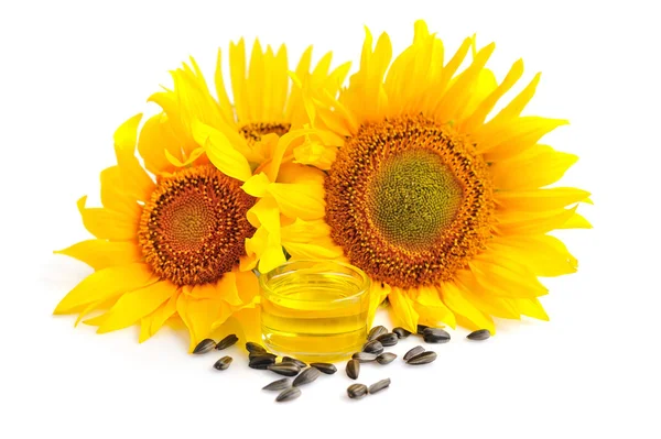 Aceite de girasol con flores y por semilla sobre fondo blanco —  Fotos de Stock