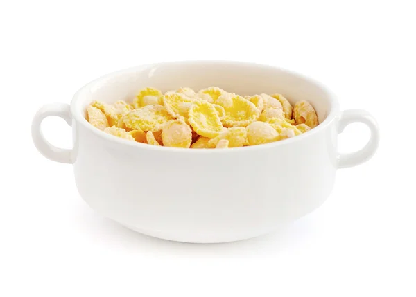 Cornflakes in Schale auf weißem Hintergrund — Stockfoto