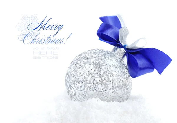 Christmas silver decoration on snow — Stock Photo, Image