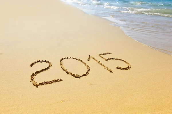 New year 2015 written on sand Stock Photo