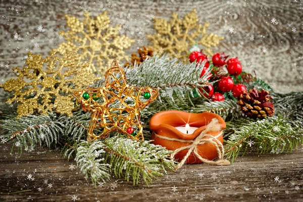Christmas composition is with candle on wooden background — Stock Photo, Image