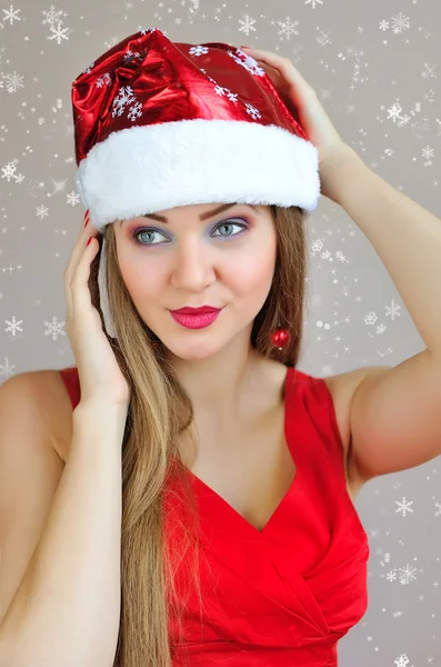 Portrait of beautiful sexy girl wearing santa claus hat — Stock Photo, Image