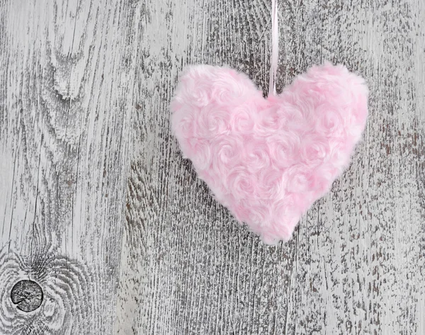 Fur pink heart on wooden background — Stock Photo, Image
