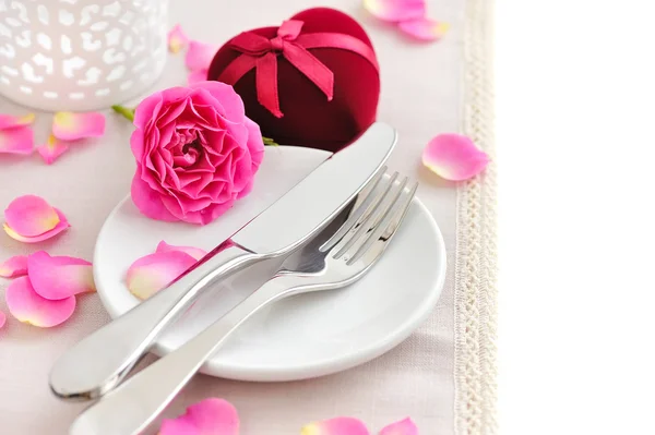 Romantic table setting with pink roses on a linen napkin Royalty Free Stock Photos