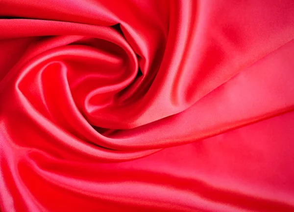 Tecido de cetim ou seda vermelho como fundo — Fotografia de Stock