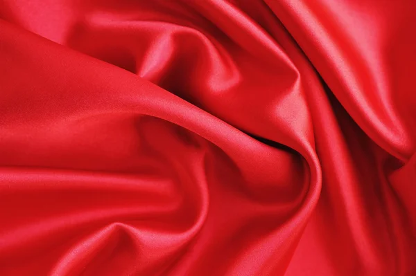 Tejido rojo satinado o de seda como fondo — Foto de Stock