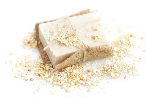 Handmade soap with oatmeal and milk on a white background — Stock Photo, Image