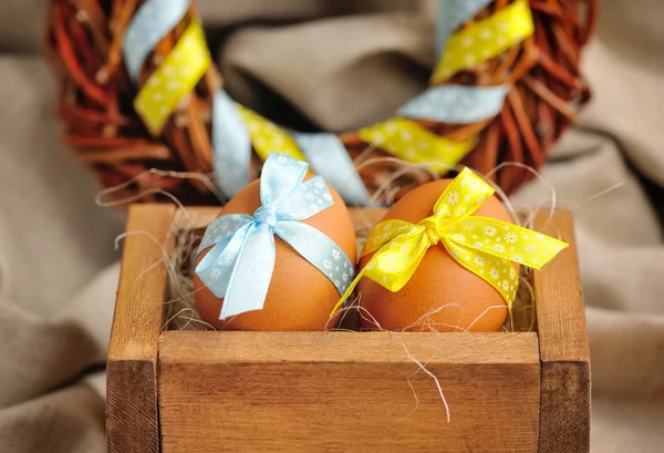 Easter eggs in wooden box — Stock Photo, Image