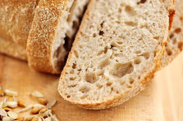 Close-up on traditional bread on wooden board — Stock Photo, Image