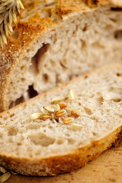 Close-up on traditional bread on wooden board — Stock Photo, Image