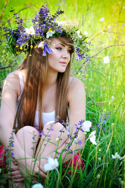 Beautiful woman with flower wreath