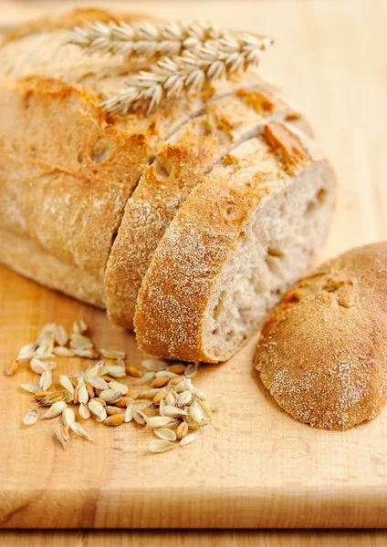 Close-up on traditional bread on wooden board — Stock Photo, Image