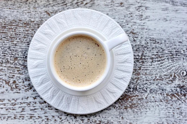 Cups of coffee on rustic wooden table background — Stock Photo, Image