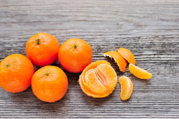 Tangerines on old wooden table — Stock Photo, Image