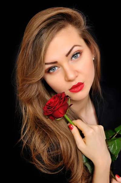 Beautiful woman with red rose on black background — Stock Photo, Image