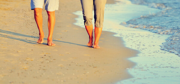 Close-up of a romantic couple along the beach