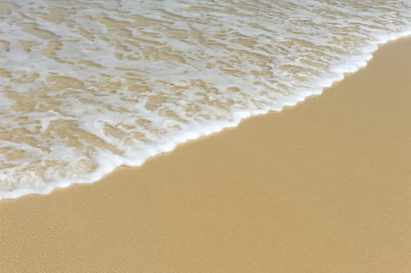 Zand en golf achtergrond — Stockfoto