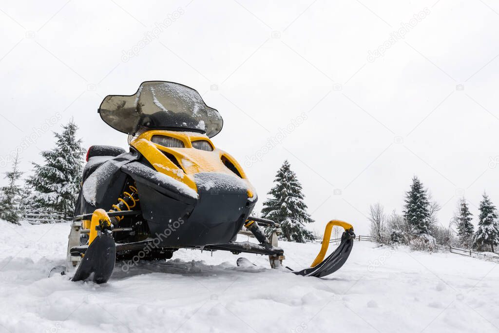 Yellow and black snowmobiles are ready for adventure ride
