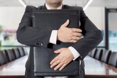 Businessman with briefcases clipart