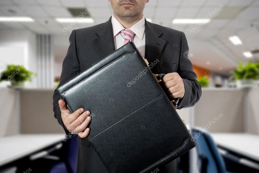 Businessman with briefcases — Stock Photo © drizzuti 58537133