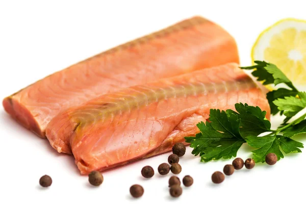 Raw salmon fillet with lemon, black pepper and parsley isolated on white — Stock Photo, Image