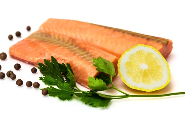 Raw salmon fillet with lemon, black pepper and parsley isolated on white — Stock Photo, Image