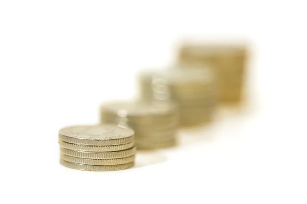 Money growth concept, where small coins in a pile gets bigger and higher for each pile — Stock Photo, Image