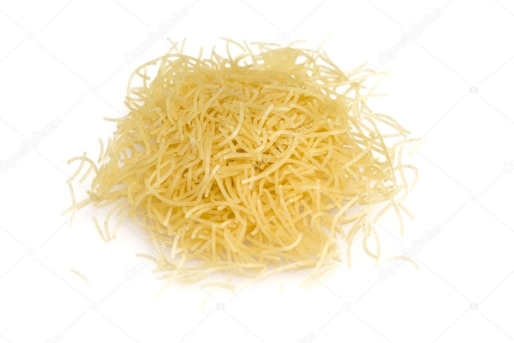 Heap of dry vermicelli, ingredient italian food isolated on white