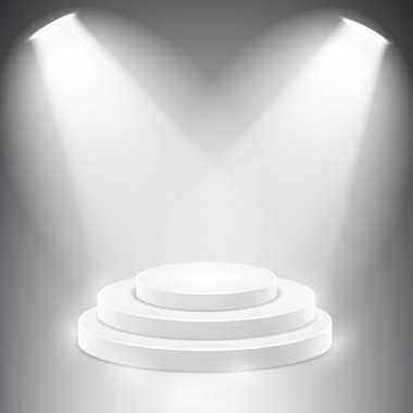 Yuvarlak podyum spot tarafından aydınlatılmış.