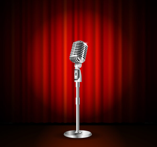 Микрофон и красный занавес

