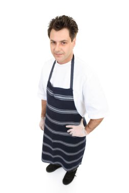 Üniformalı bir kasap ya da manav el pençe divan duruyor..