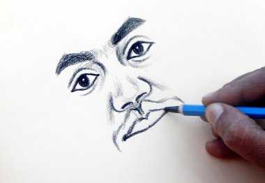 Hintli sanatçı bir portre çizim