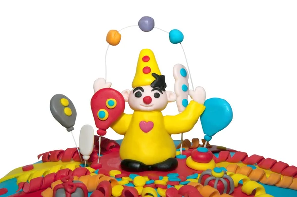 Parte di una torta di compleanno con un clown — Foto Stock
