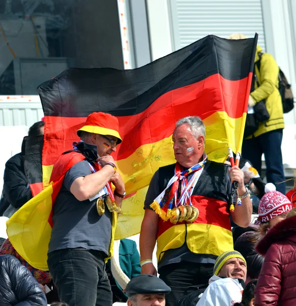 Two sport funs with national flags of Germany